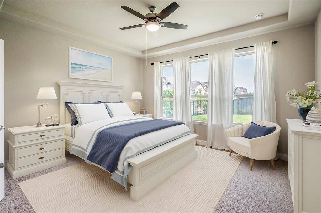 Welcome inside your sanctuary! This primary bedroom overlooks your beautiful backyard.