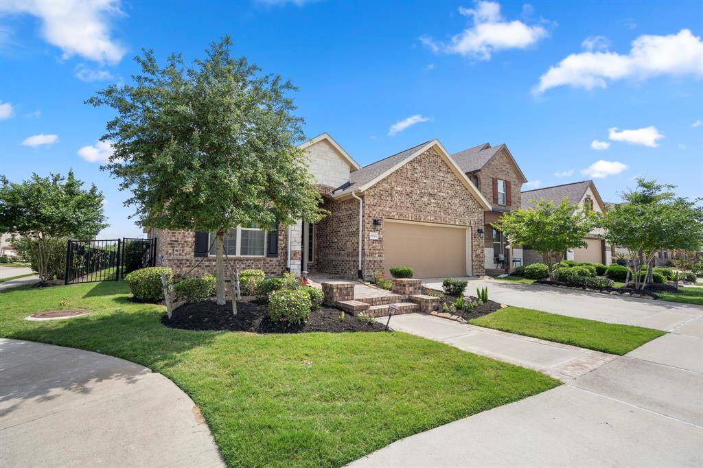 Situated on a corner lot, you have a beautifully-landscaped front lawn with neighbors on only one side.