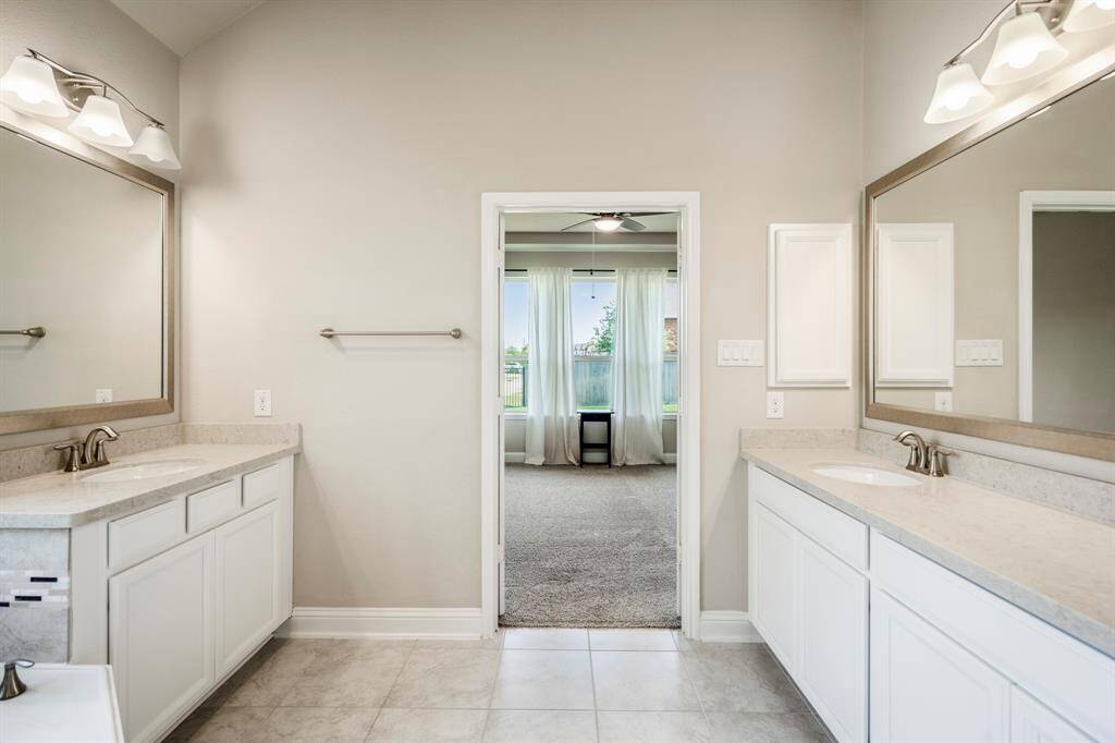 This is your spacious primary bathroom retreat with double vanities and incredible counter space.