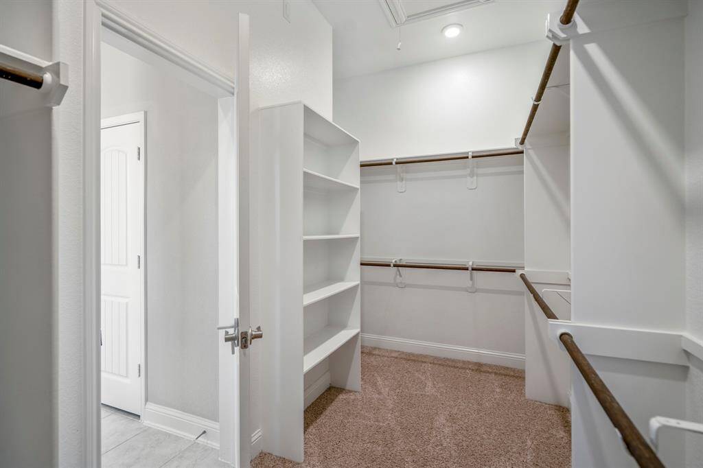 Plenty of built-ins and hanging space in this closet.