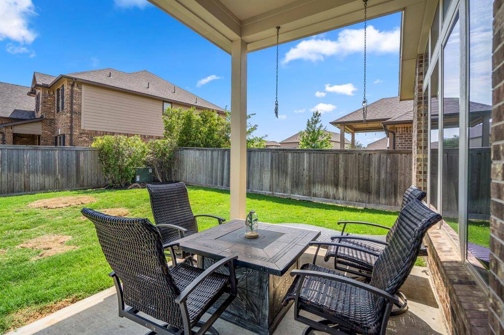 Welcome outside to the covered backyard patio.