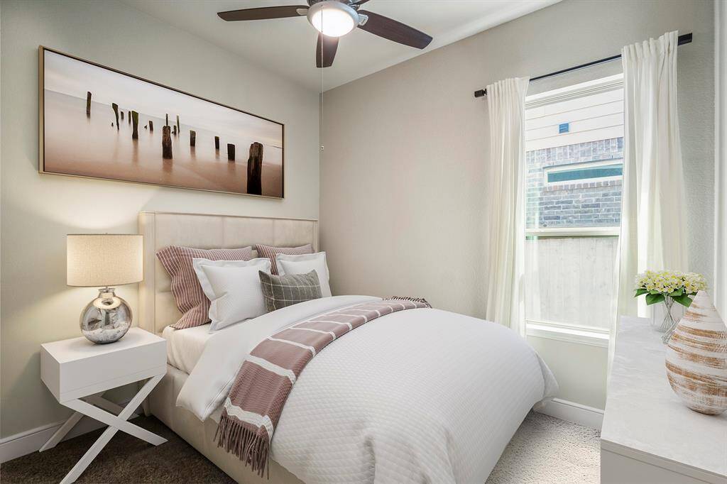 One of three front bedrooms in this lovely home. (virtually staged furniture)