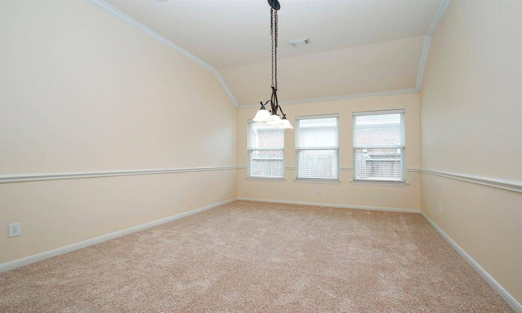 Spacious formal dining room or game area. Maybe a pool table?