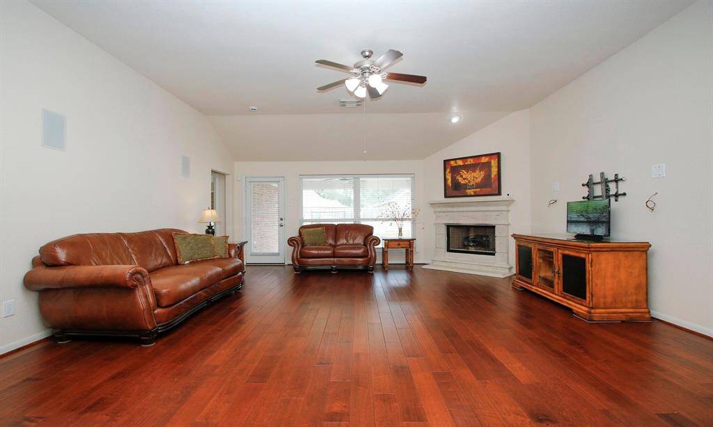 Handscraped wood floors in the family room are in excellent shape!
