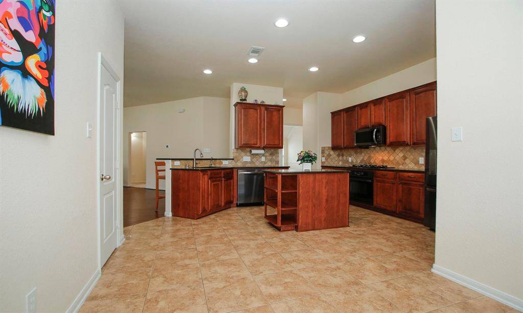 Door to pantry and fully open to kitchen.