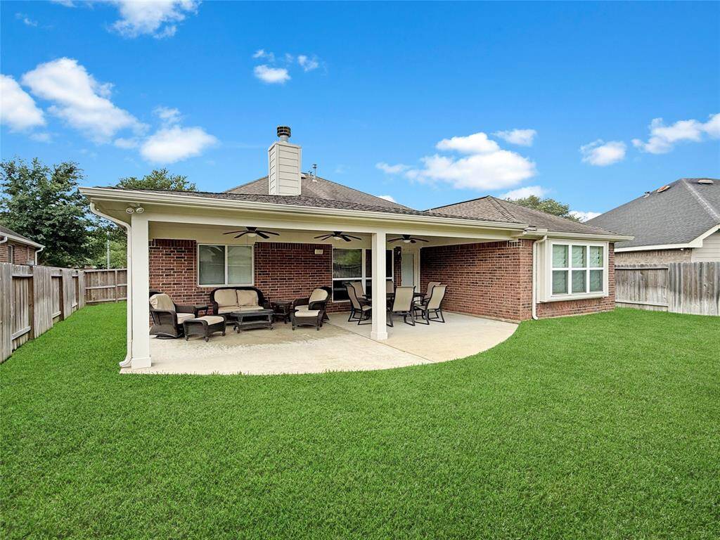 Half moon patio offers optimum entertaining space.