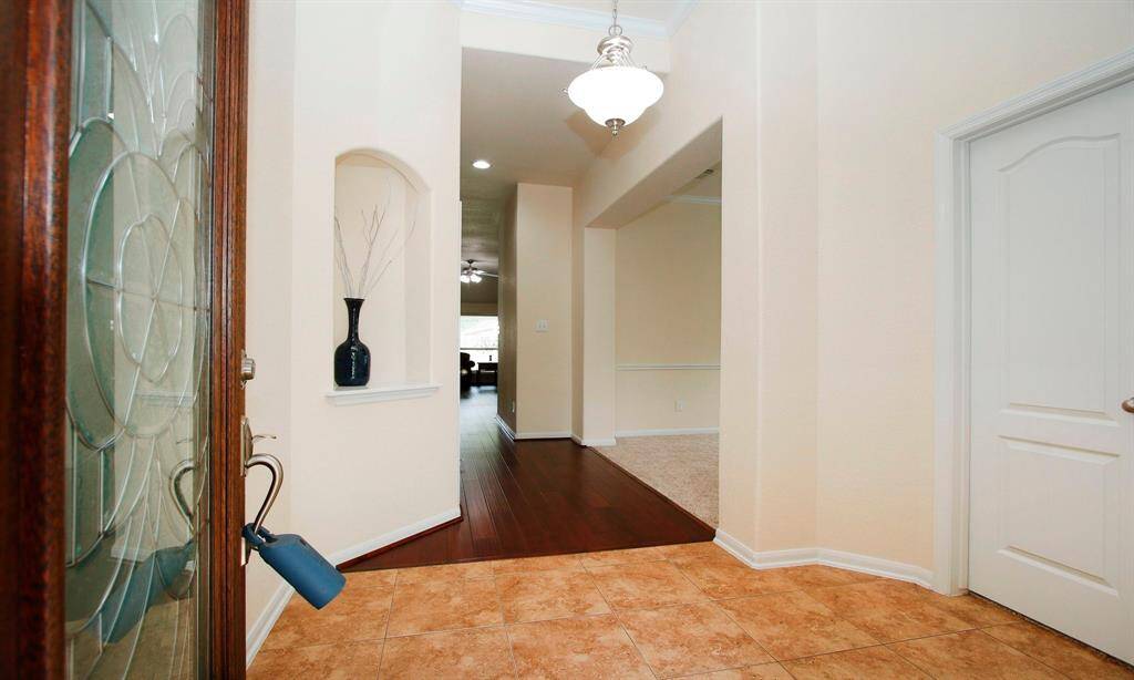 Enter through the solid wood mahoganny door with etched glass