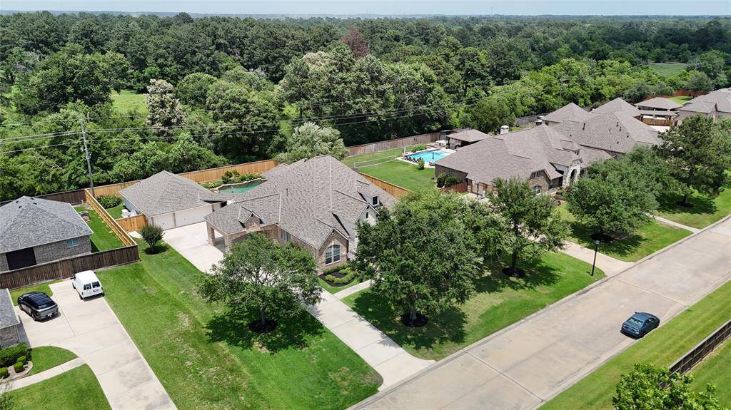 No neighbors behind home, just trees.