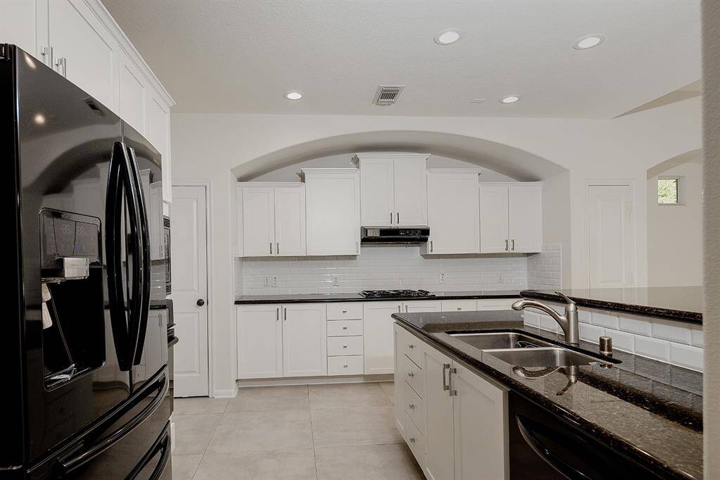 REFRIGERATOR HAS BEEN REPLACED WITH NEW STAINLESS STEEL UNIT