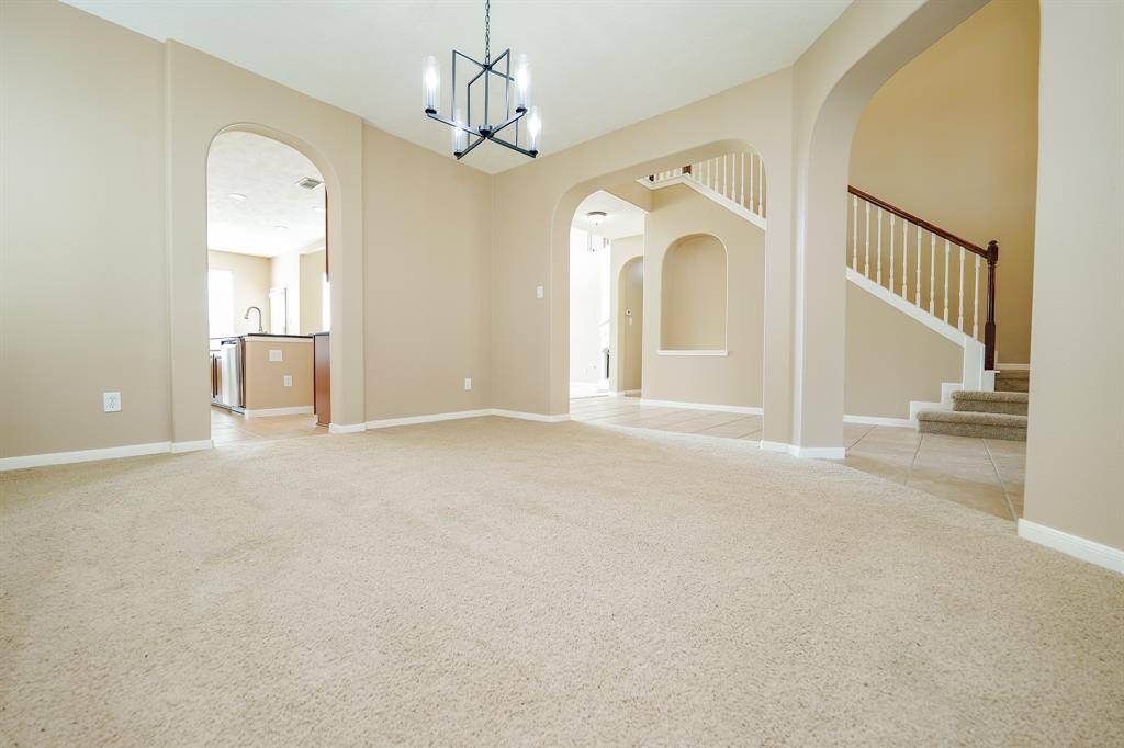 Living is easy in the open concept floor plan of this home with walls of windows for natural lighting.