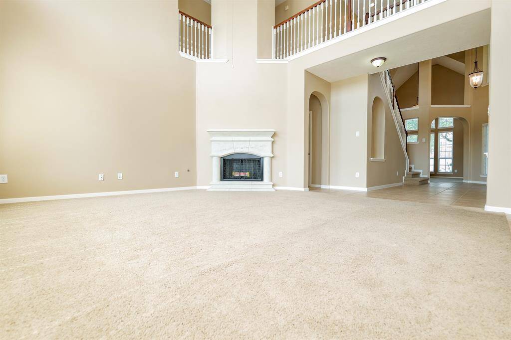 Enjoy a night by the fire or a movie night or game night... the opportunities are endless in this family room.