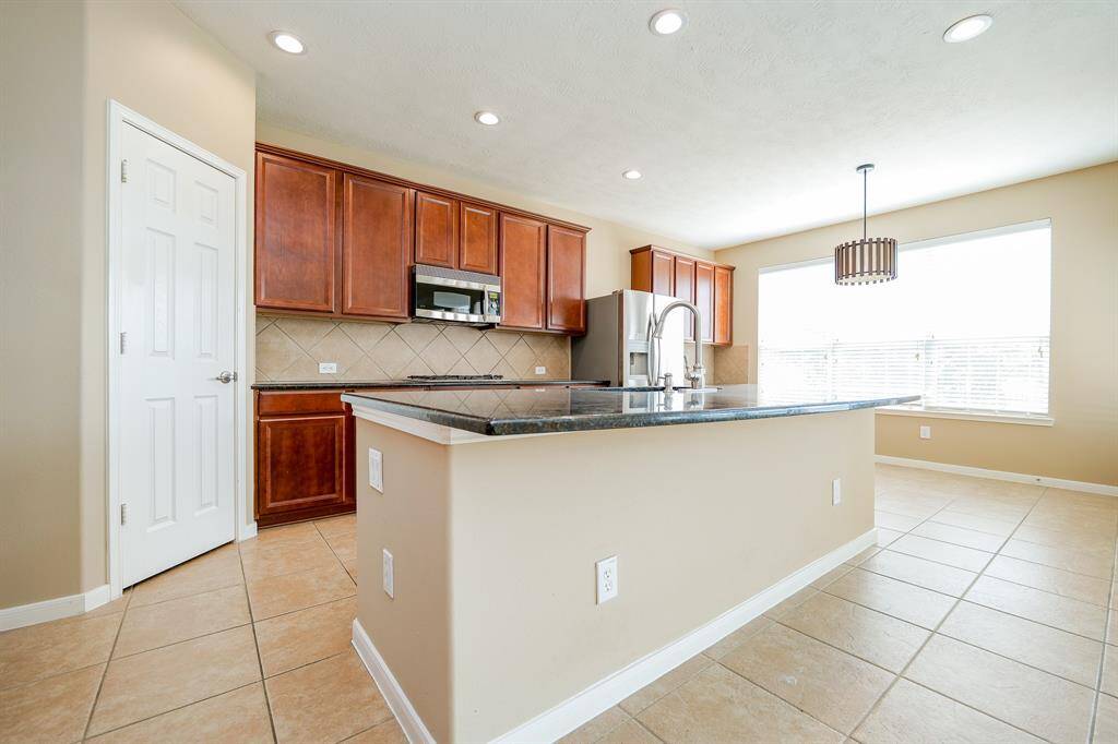 Welcome to the heart of the home - this kitchen awaits your culinary dreams! With granite countertops and ample storage and prep space, enjoy prepping meals from cozy breakfast to elegant meals, this kitchen is where memories are made....