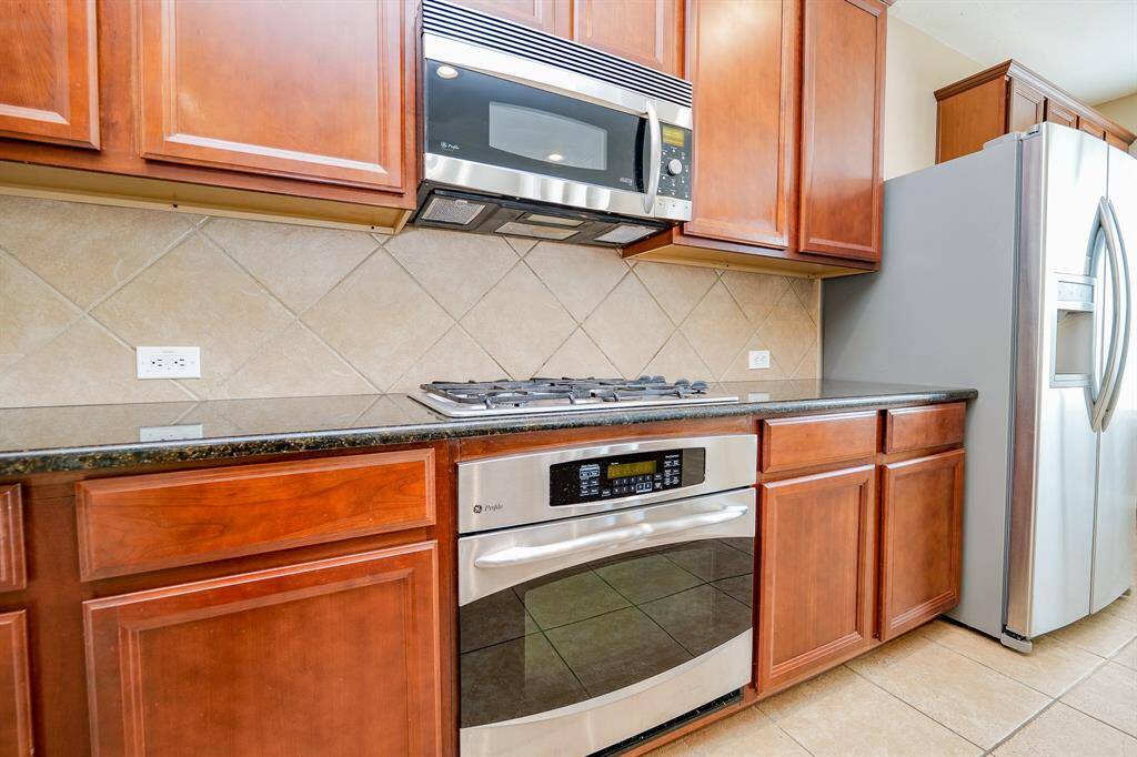 It will be a pleasure to whip something up in the well-designed kitchen Gorgeous granite is just one of the features of this trendy kitchen