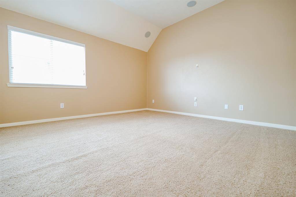 Another Bedroom nestled on the second floor, featuring neutral-toned carpeting and soft, light paint hues that offer endless possibilities for personalization.
