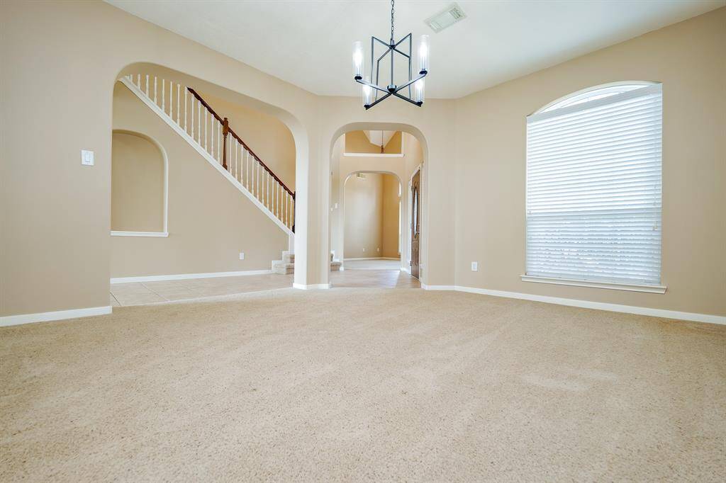 The open layout seamlessly connects this dining space to the heart of the home, creating an inviting atmosphere for memorable meals and celebrations.
