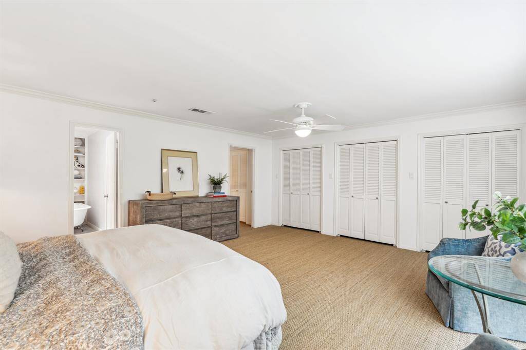 This bedroom offers exceptional storage with an entire wall of closets—plus a large walk-in closet located in the en-suite bathroom.