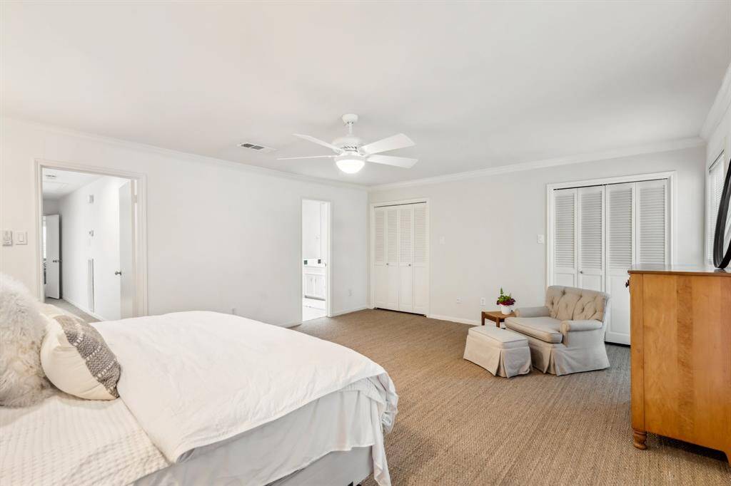 This bedroom features wall closets plus a large walk-in closet—plenty of storage throughout the home.