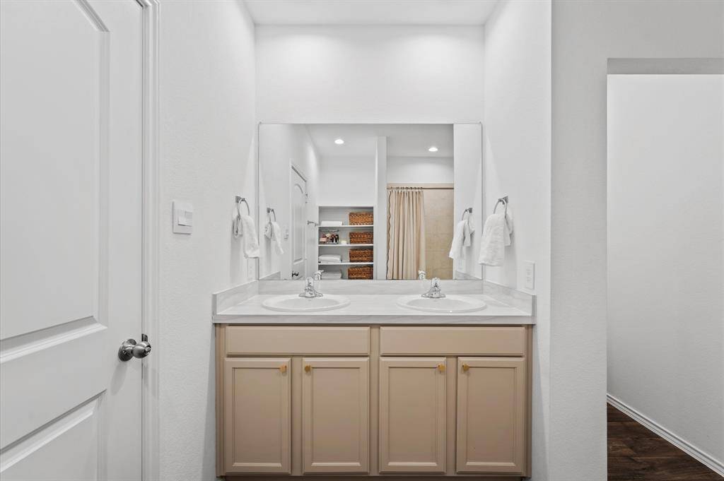 Primary bathroom has double sinks.