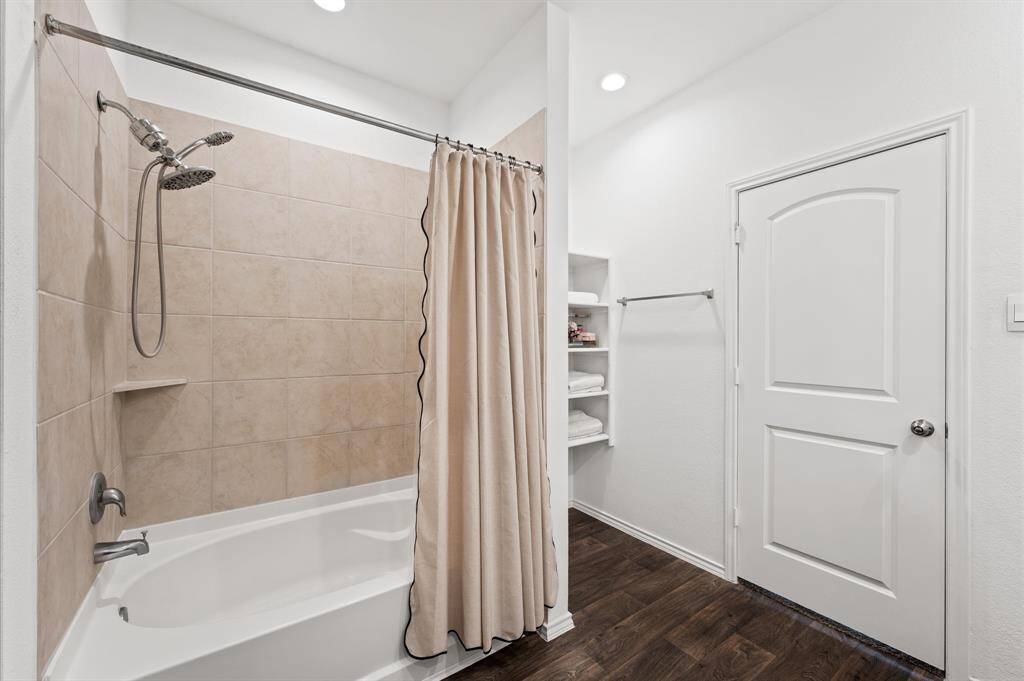 Primary bath has upgraded shower head.