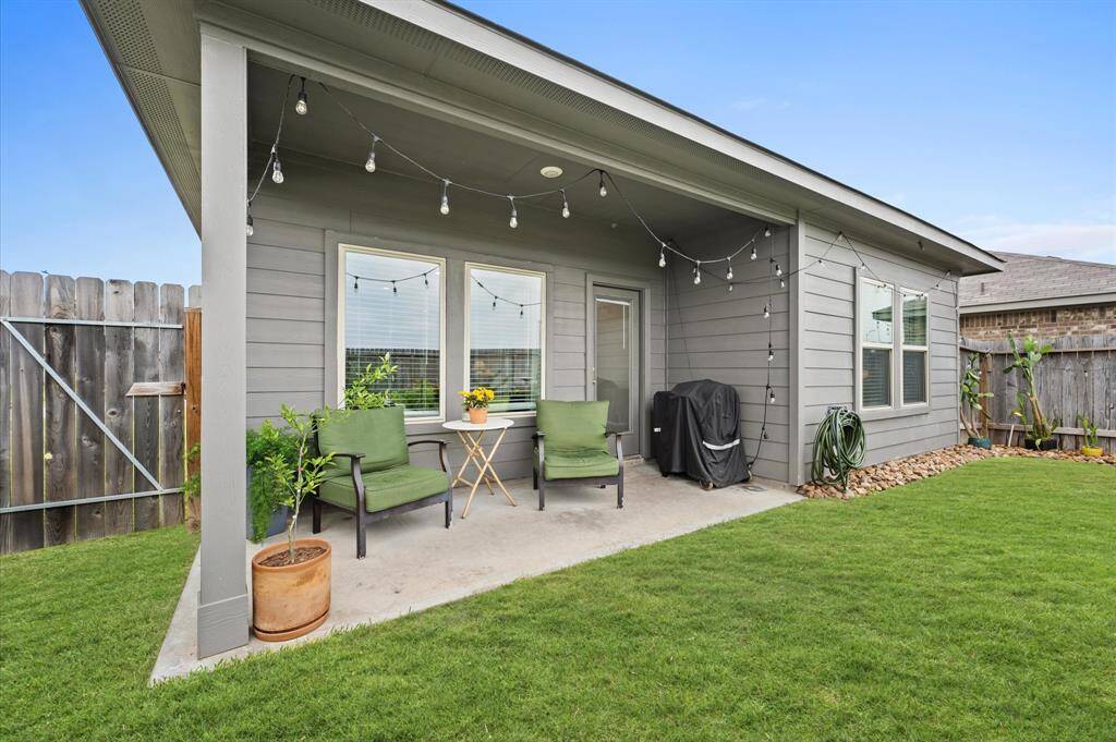 Covered patio off first floor living.