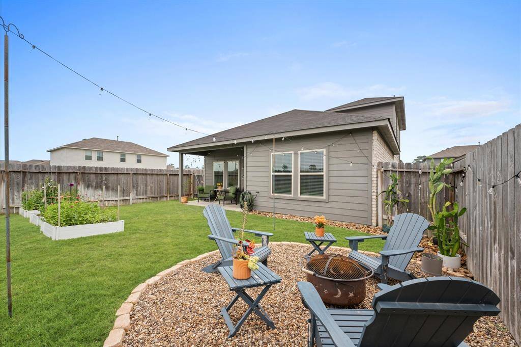 This backyard is perfect for relaxation or entertaining.