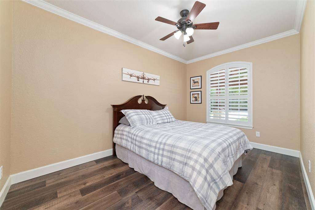 A second bedroom on the main floor functions as a private suite with its own ensuite bathroom.