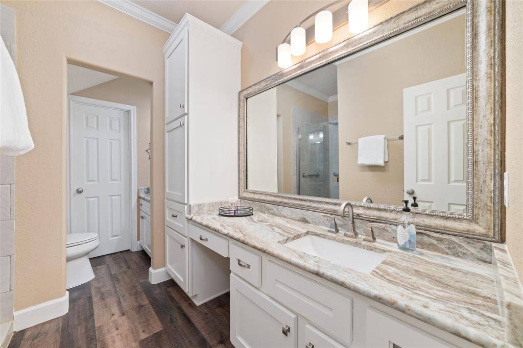 The ensuite bathroom includes a full shower and modern finishes for comfort and convenience