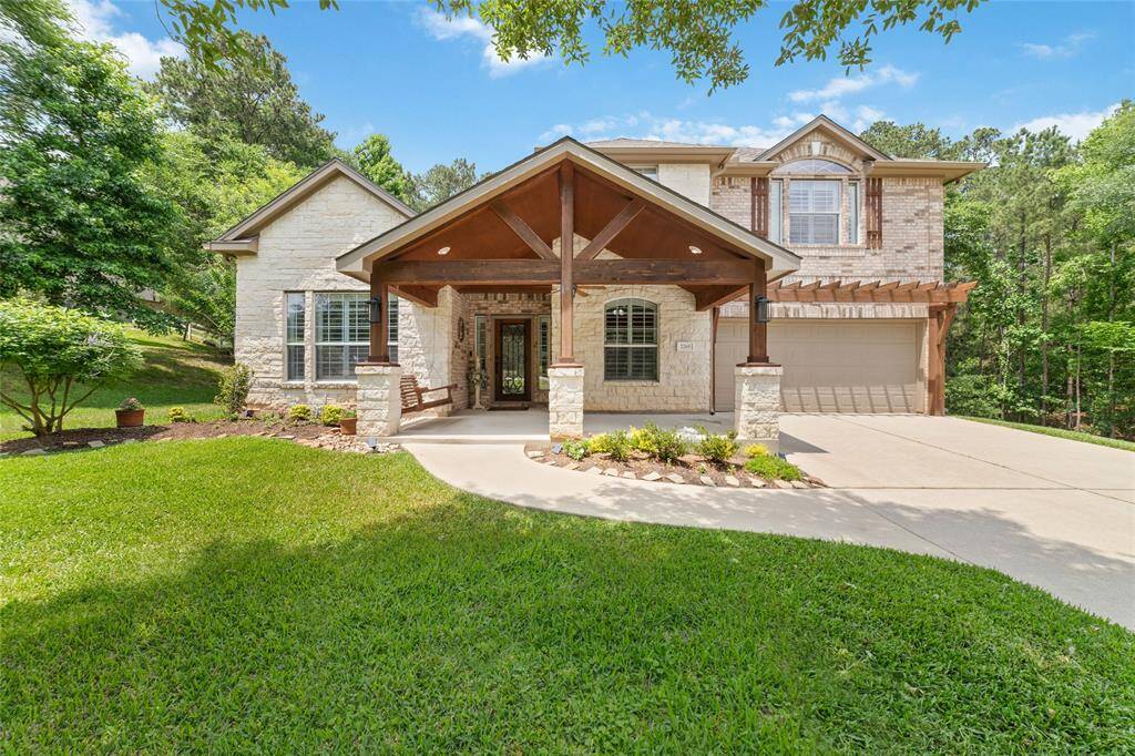 A long, private driveway leads you into the heart of this wooded retreat, offering a grand sense of arrival and seclusion.