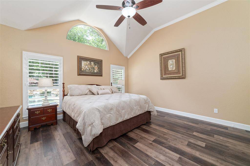 The spacious primary bedroom is located on the main floor and features luxury vinyl plank flooring.