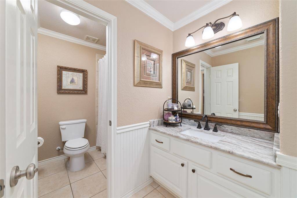A Jack-and-Jill bathroom connects the upstairs bedrooms, providing functional access and privacy.