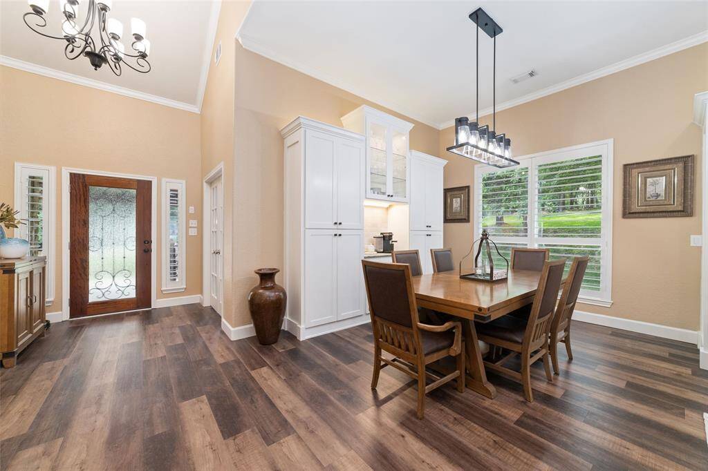 A built-in coffee bar in the dining room with custom cabinetry adds convenience and charm to your morning routine.