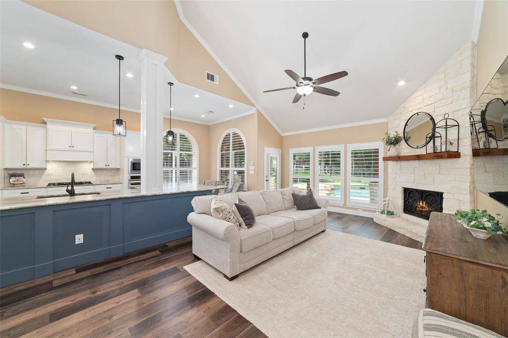 Large windows with plantation shutters bring in natural light while offering privacy and classic elegance.