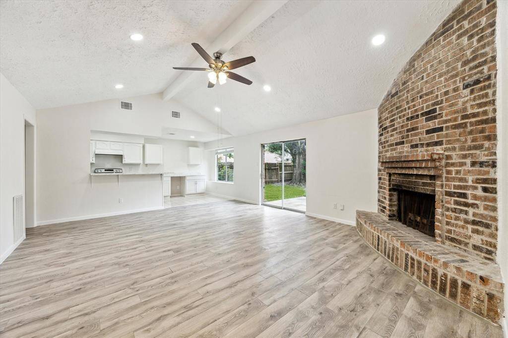 Spacious open floor plan with kitchen adjacent to the living area.