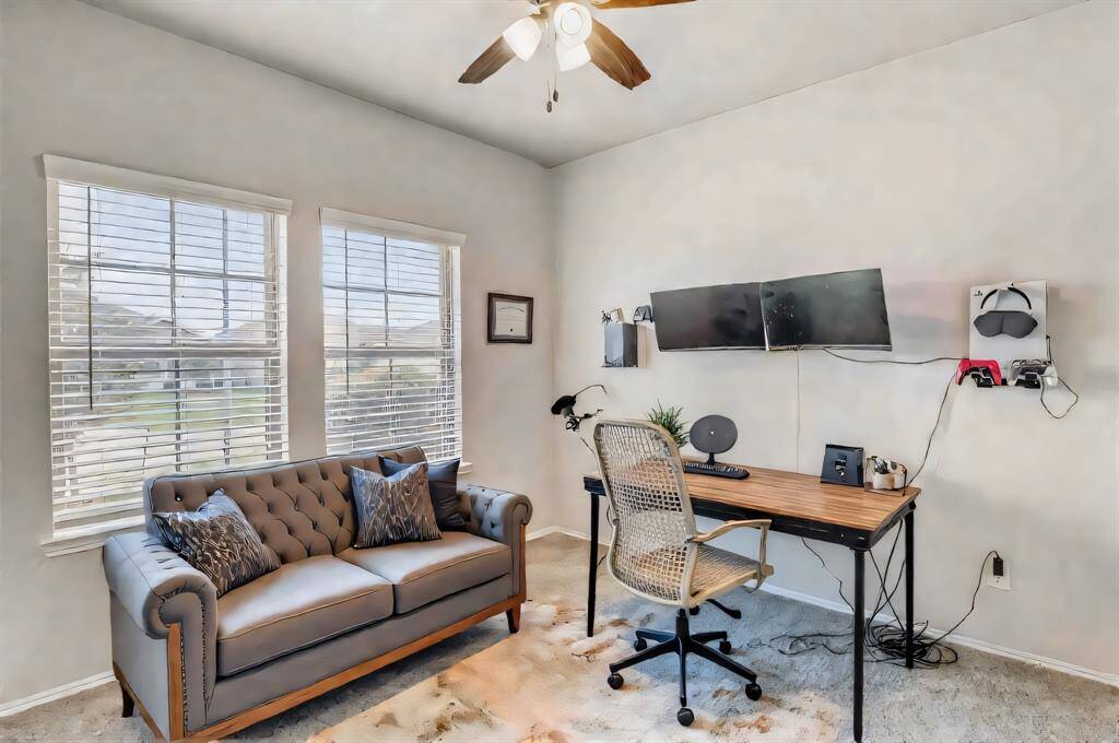 5th bedroom DOWNSTAIRS currently being used as a private office.  This extra bedroom downstairs is perfect for guests, but can be anything you need it to be - playroom, formal sitting room, music room - your choice!