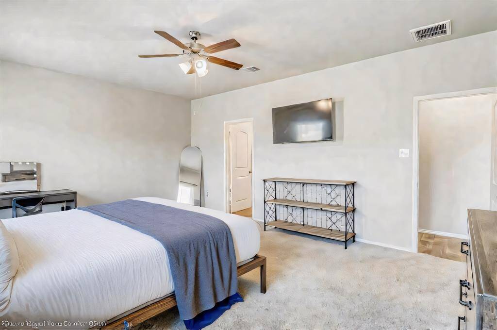 Primary bedroom is intimate and inviting, yet also light and airy.