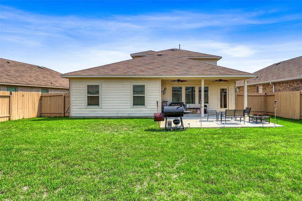 A spacious and carpeted upstairs game room—ideal for games, movie nights, or a cozy second lounge. Oversized windows add a cheerful glow throughout the day.