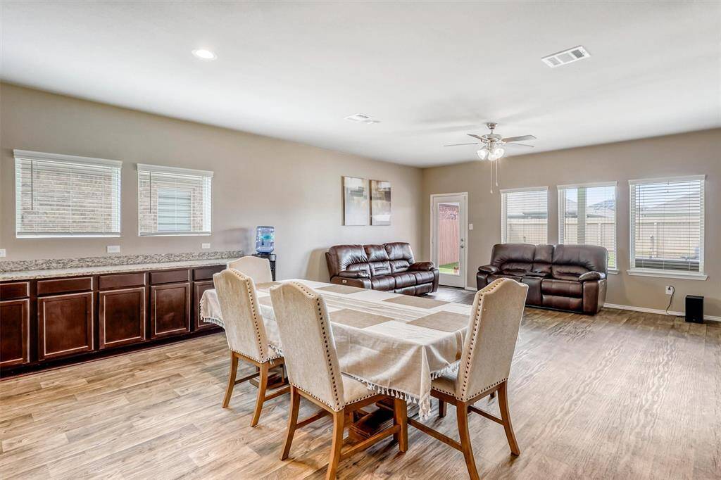 The dining area is bathed in natural light from generously sized windows, offering the perfect setting for everyday meals or celebratory feasts. Huge built in buffet is perfect for serving guests and provides a huge amount of storage!
