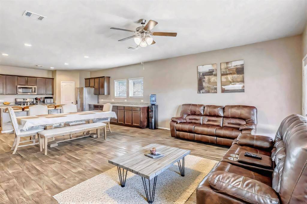 The dining and open living area make a great party space!*partially virtually staged.