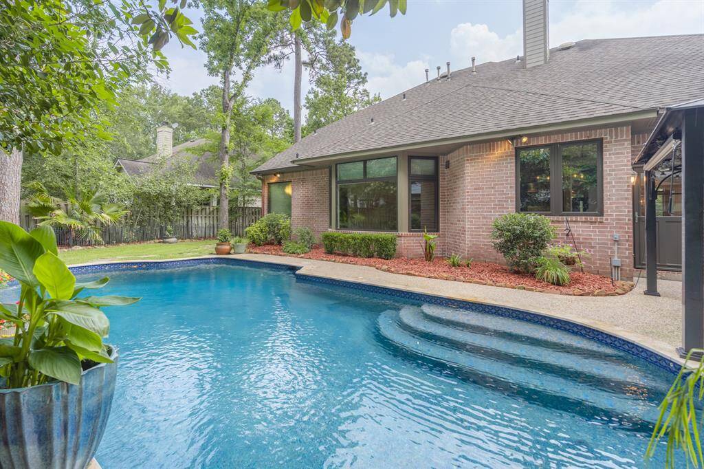 Backyard oasis, mature landscaping, private yard, Pebbletec Pool with Wi-Fi remote.