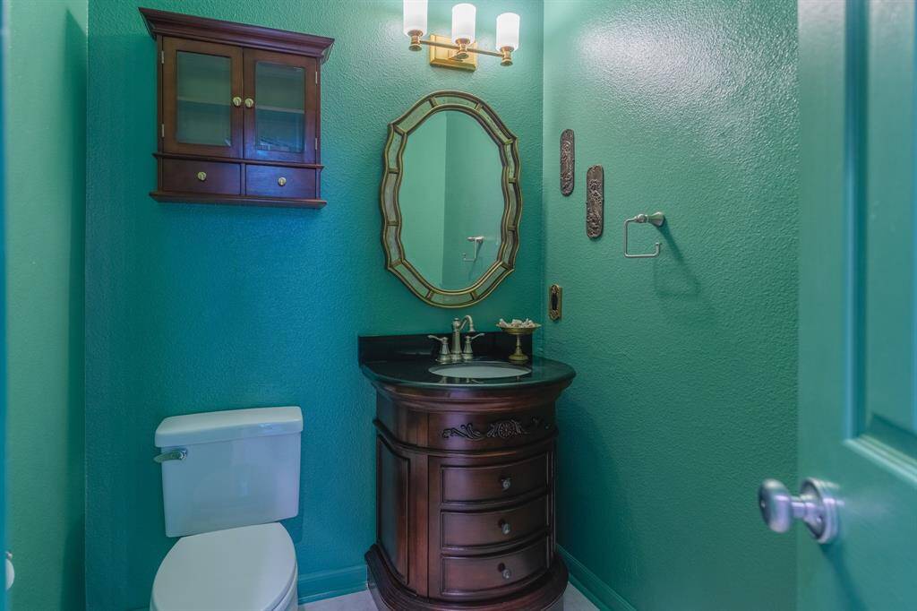 1/2 Bath on First Floor, right outside utility room, and main living area.
