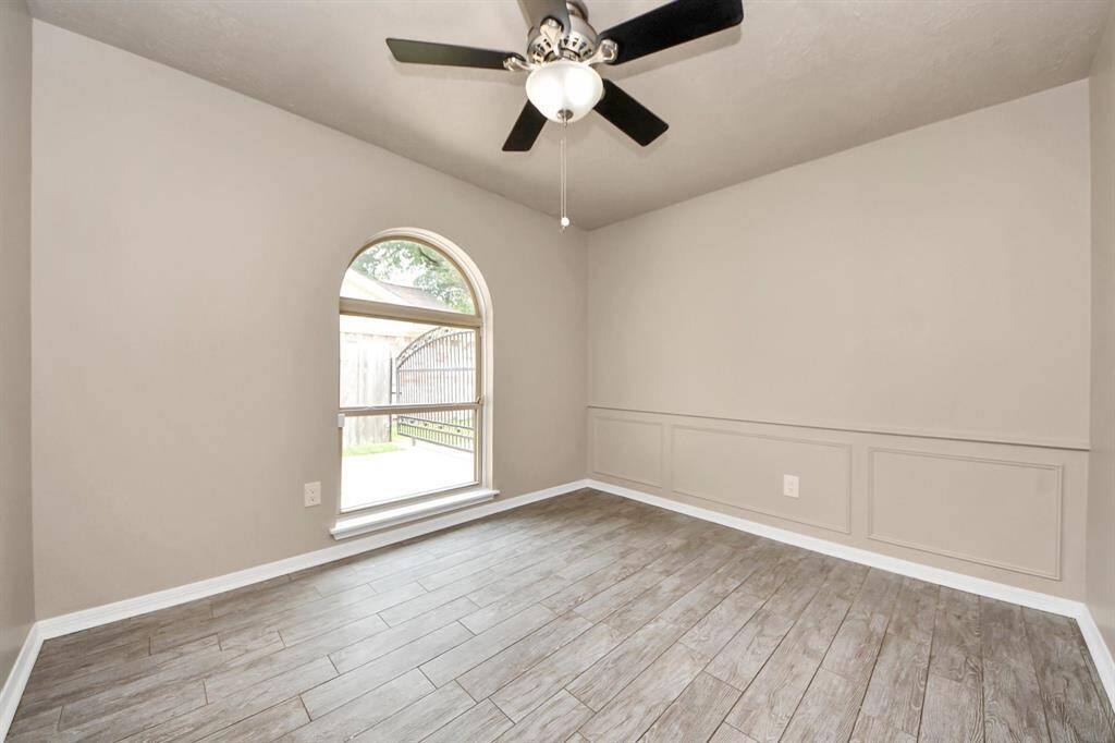 Generously sized windows flood the space with an abundance of natural light, creating a bright and inviting atmosphere.