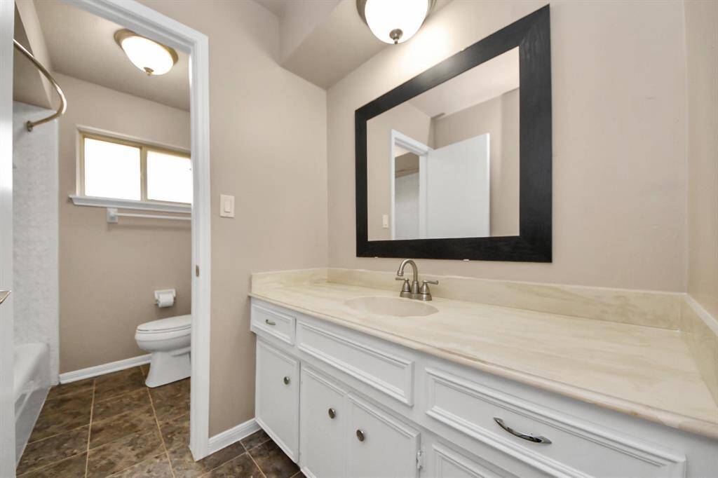 Beautifully appointed guest bath featuring stylish finishes and a serene atmosphere—perfect for visitors to feel at home.