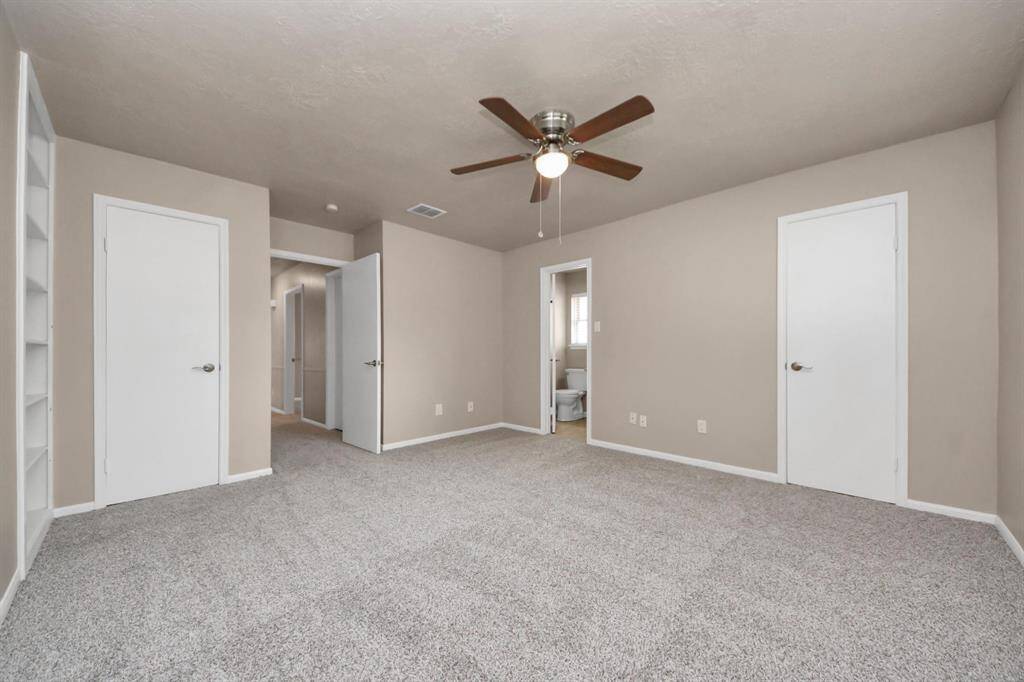 The primary bedroom offers the convenience of two spacious closets, providing ample storage and organization options.