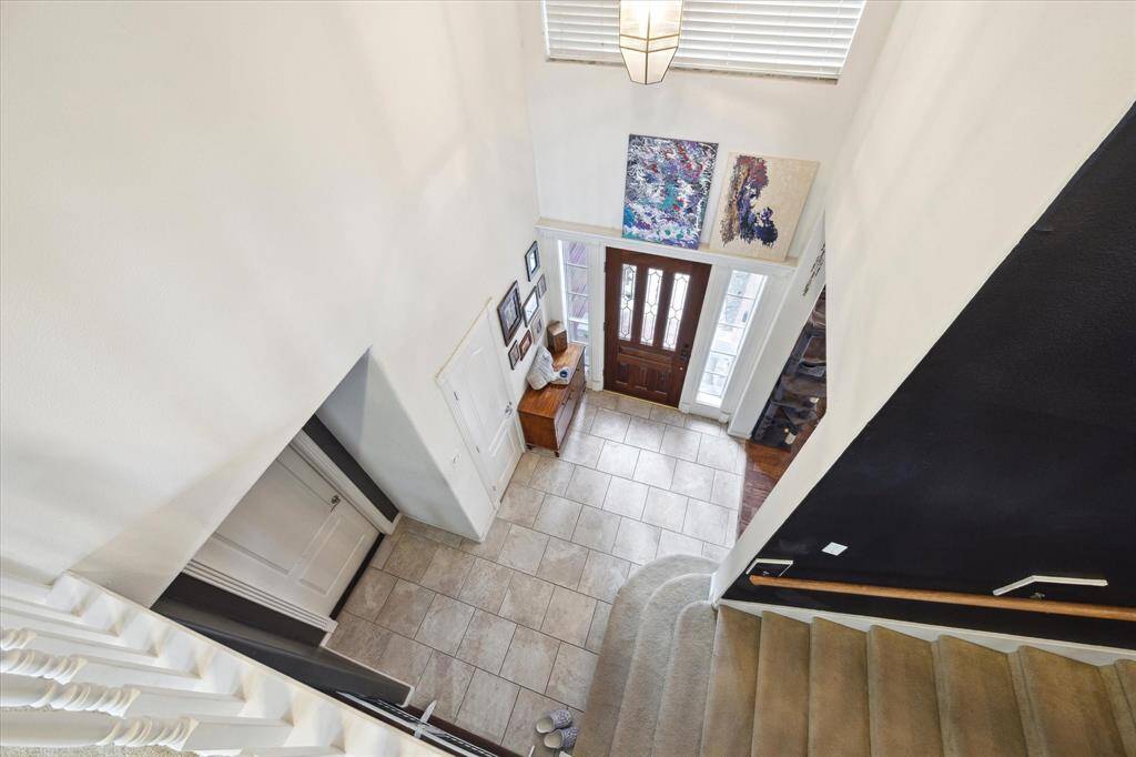 UPSTAIRS, YOU HAVE A GRAND VIEW OF THE FOYER.