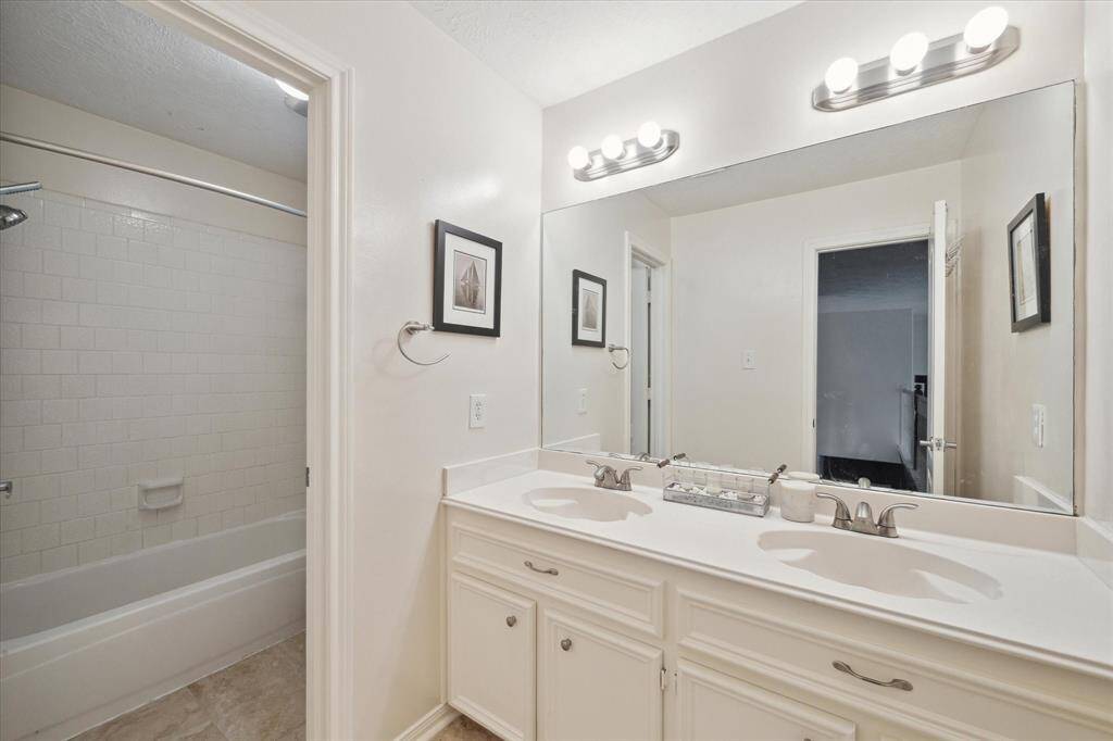 SECOND FULL BATH WITH RECENT TILE FLOORS.