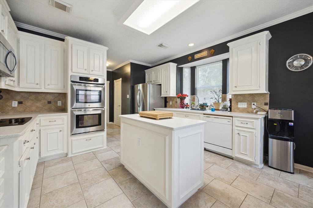 YOU'LL LOVE ALL STAINLESS-STEEL APPLIANCES INCLUDING DOUBLE OVENS.