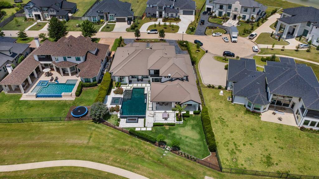 An aerial perspective of the expansive lakefront lot reveals not only its generous dimensions but also the ample yard space perfect for outdoor activities and relaxation.