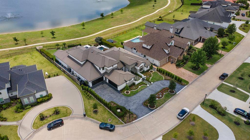 A captivating aerial view from the front highlights the picturesque trail path, allowing easy access to nearby restaurants and entertainment right from your backyard.