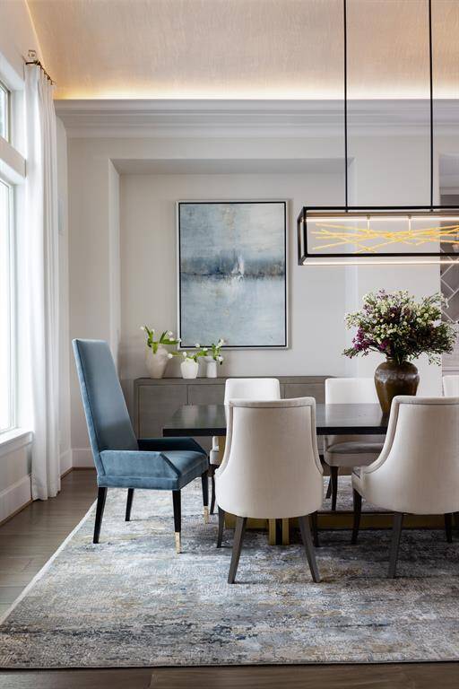 To the left of the entrance, the formal dining room captivates with its beautifully arched ceiling, creating a refined atmosphere perfect for elegant gatherings and special occasions.