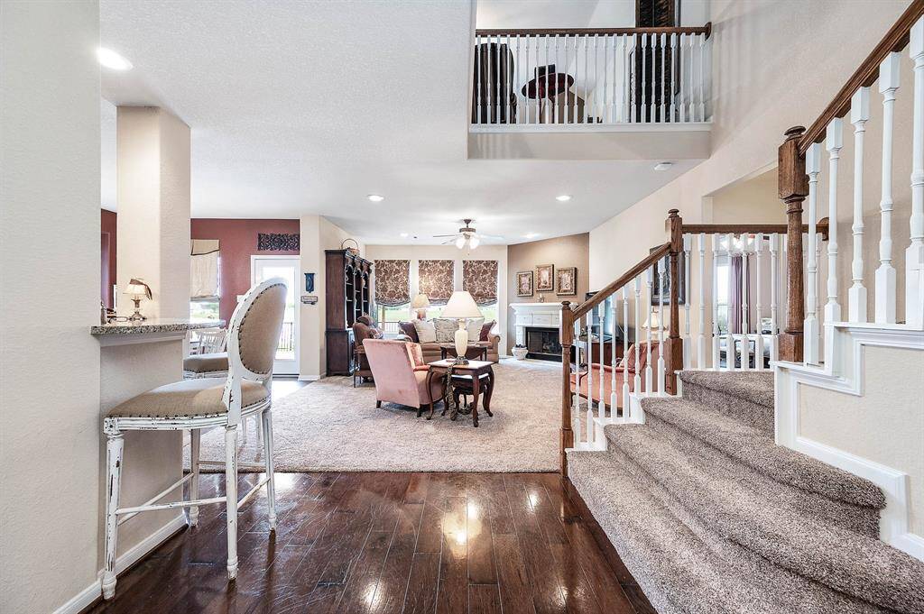 View towards the back -- and heart -- of the home, the Family room and Kitchen.